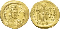Byzantine Coins JUSTINIAN I (527-565). GOLD Solidus. Constantinople. Obv: D N IVSTINIANVS P P AVG. Helmeted and cuirassed bust facing slightly right, holding spear and shield decorated with horseman m