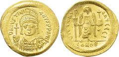 Byzantine Coins JUSTINIAN I (527-565). GOLD Solidus. Constantinople. Obv: D N IVSTINIANVS P P AVG. Helmeted and cuirassed bust facing, holding globus cruciger and shield decorated with horseman motif.
