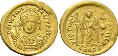 Byzantine Coins JUSTINIAN I (527-565). GOLD Solidus. Constantinople. Obv: D N IVSTINIANVS P P AVG. Helmeted and cuirassed bust facing, holding globus cruciger and shield decorated with horseman motif.