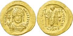 Byzantine Coins JUSTINIAN I (527-565). GOLD Solidus. Constantinople. Obv: D N IVSTINIANVS P P AVG. Helmeted and cuirassed bust facing, holding globus cruciger and shield decorated with horseman motif.