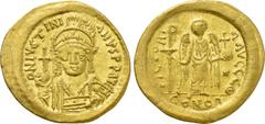 Byzantine Coins JUSTINIAN I (527-565). GOLD Solidus. Constantinople. Obv: D N IVSTINIANVS P P AVG. Helmeted and cuirassed bust facing, holding globus cruciger and shield decorated with horseman motif.