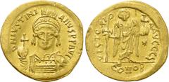 Byzantine Coins JUSTINIAN I (527-565). GOLD Solidus. Constantinople. Obv: D N IVSTINIANVS P P AVG. Helmeted and cuirassed bust facing, holding globus cruciger and shield decorated with horseman motif.
