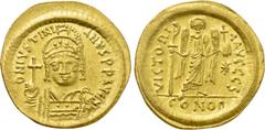 Byzantine Coins JUSTINIAN I (527-565). GOLD Solidus. Constantinople. Obv: D N IVSTINIANVS P P AVG. Helmeted and cuirassed bust facing, holding globus cruciger and shield decorated with horseman motif.
