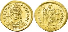 Byzantine Coins JUSTINIAN I (527-565). GOLD Solidus. Constantinople. Obv: D N IVSTINIANVS P P AVG. Helmeted and cuirassed bust facing, holding globus cruciger and shield decorated with horseman motif.