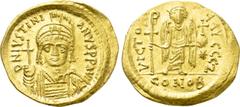 Byzantine Coins JUSTINIAN I (527-565). GOLD Solidus. Constantinople. Obv: D N IVSTINIANVS P P AVG. Helmeted and cuirassed bust facing, holding globus cruciger and shield decorated with horseman motif.