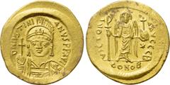 Byzantine Coins JUSTINIAN I (527-565). GOLD Solidus. Constantinople. Obv: D N IVSTINIANVS P P AVG. Helmeted and cuirassed bust facing, holding globus cruciger and shield decorated with horseman motif.