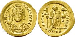 Byzantine Coins JUSTINIAN I (527-565). GOLD Solidus. Constantinople. Obv: D N IVSTINIANVS P P AVG. Helmeted and cuirassed bust facing, holding globus cruciger and shield decorated with horseman motif.