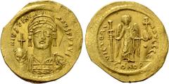 Byzantine Coins JUSTINIAN I (527-565). GOLD Solidus. Constantinople. Obv: D N IVSTINIANVS P P AVG. Helmeted and cuirassed bust facing, holding globus cruciger and shield decorated with horseman motif.