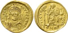 Byzantine Coins JUSTINIAN I (527-565). GOLD Solidus. Constantinople. Obv: D N IVSTINIANVS P P AVG. Helmeted and cuirassed bust facing, holding globus cruciger and shield decorated with horseman motif.