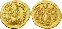 Byzantine Coins JUSTINIAN I (527-565). GOLD Solidus. Constantinople. Obv: D N IVSTINIANVS P P AVG. Helmeted and cuirassed bust facing, holding globus cruciger and shield decorated with horseman motif.