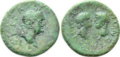 Roman Provincial Coins UNCERTAIN. Vespasian with Titus and Domitian (69-79). Ae. Obv: VESPASIANO AVG. Laureate head of Vespasian right. Rev: TITO ET DOMITIANO CAES. Bare heads of Titus and Domitian fa