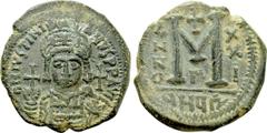 Byzantine Coins JUSTINIAN I (527-565). Follis. Theoupolis (Antioch). Dated RY 21 (547/8). Obv: D N IVSTINIANVS P P AVG. Helmeted and cuirassed bust facing, holding globus cruciger and shield decorated