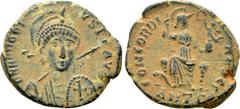 Roman Imperial Coins HONORIUS (393-423). Ae. Antioch. Obv: D N HONORIUS P F AVG. Helmeted and cuirassed bust facing slightly right, holding spear and decorated shield. Rev: CONCORDIA AVGG / ANT Γ. Con