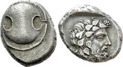 Greek Coins BOEOTIA. Thebes. Stater (Circa 425-395 BC). Obv: Boiotian shield. Rev: Θ - E. Head of Dionysos right, wearing ivy wreath. SNG Copenhagen 284. Condition: Very fine. Weight: 11.91 g. Diamete