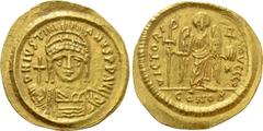 Byzantine Coins JUSTINIAN I (527-565). GOLD Solidus. Constantinople. Obv: D N IVSTINIANVS P P AVG. Helmeted and cuirassed bust facing, holding globus cruciger and shield decorated with horseman motif.