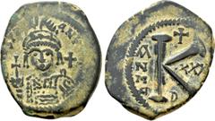 Byzantine Coins JUSTINIAN I (527-565). Half Follis. Antioch. Obv: D N IVSTINIANVS P P AVG. Helmeted and cuirassed bust facing, holding globus cruciger and shield decorated with horseman motif. Rev: La
