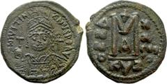 Byzantine Coins JUSTINIAN I (527-565). Follis. Kyzikos. Dated RY 27 (553/554).. Obv: D N IVSTINIANVS P P AVG. Helmeted, draped and cuirassed bust facing, holding globus cruciger and shield; cross in r