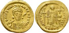 Byzantine Coins JUSTINIAN I (527-565). GOLD Solidus. Constantinople. Obv: D N IVSTINIANVS P P AVG. Helmeted and cuirassed bust facing slightly right, holding spear and shield decorated with horseman m