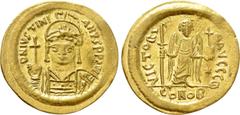 Byzantine Coins JUSTINIAN I (527-565). GOLD Solidus. Constantinople. Obv: D N IVSTINIANVS P P AVG. Helmeted and cuirassed bust facing, holding globus cruciger and shield decorated with horseman motif.