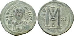 Byzantine Coins JUSTINIAN I (527-565). Follis. Constantinople. Dated RY 12 (538/9). Obv: D N IVSTINIANVS P P AVG. Helmeted and cuirassed bust facing, holding globus cruciger and shield decorated with 