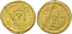 Byzantine Coins JUSTINIAN I (527-565). GOLD Solidus. Constantinople. Obv: D N IVSTINIANVS P P AVG. Helmeted and cuirassed bust facing, holding globus cruciger and shield decorated with horseman motif.