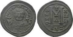 Byzantine Coins JUSTINIAN I (527-565). Follis. Cyzicus. Dated RY 14 (550/1). Obv: D N IVSTINIANVS P P AVG. Helmeted and cuirassed bust facing, holding globus cruciger and shield decorated with horsema