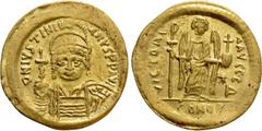 Byzantine Coins JUSTINIAN I (527-565). GOLD Solidus. Constantinople. Obv: D N IVSTINIANVS P P AVG. Helmeted, draped and cuirassed bust facing, holding globus cruciger and shield with horseman motif. R