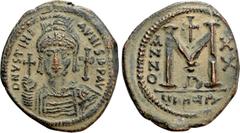 Byzantine Coins JUSTINIAN I (527-565). Follis. Antioch. Dated RY 20 (546/7). Obv: D N IVSTINIANVS P P AVG. Helmeted and cuirassed bust facing, holding globus cruciger and shield decorated with horsema