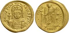 Byzantine Coins JUSTINIAN I (527-565). GOLD Solidus. Constantinople. Obv: D N IVSTINIANVS P P AVG. Helmeted and cuirassed bust facing, holding globus cruciger and shield decorated with horseman motif.