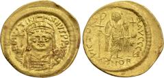 Byzantine Coins JUSTINIAN I (527-565). GOLD Solidus. Constantinople. Obv: D N IVSTINIANVS P P AVG. Helmeted and cuirassed bust facing, holding globus cruciger and shield decorated with horseman motif.
