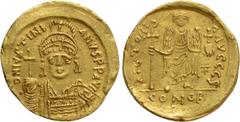 Byzantine Coins JUSTINIAN I (527-565). GOLD Solidus. Constantinople. Obv: D N IVSTINIANVS P P AVG. Helmeted and cuirassed bust facing, holding globus cruciger and shield decorated with horseman motif.