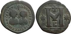 Byzantine Coins JUSTIN I and JUSTINIAN I (527). Follis. Antioch. Obv: D N D N IVSTINVS ЄT IVSTINIANVS P P AV. Nimbate and draped facing busts of Justin and Justinian; cross above. Rev: Large M between
