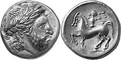 KELTEN MITTLERE UND UNTERE DONAU Nachahmungen der Tetradrachmen und Teilstücke Philipps II. Objekt-Nr.: 1037 Audoleon-Typus Tetradrachme, (13,67 g.), Rs.: Stilisierter Zeuskopf mit Lorbeerkranz n. r. 