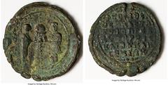 Ancients Greek Ekdikoi of the Hagia Sophia (AD 11th-12th centuries). Lead seal (57mm, 84.23 gm, 11h). XF, bent. IOVCTINIAN ΔЄC ΘEOTOKE BOHΘEI, Theotokos and Justinian I, nimbate, standing facing, hold