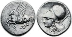 CORINTHIA. Corinth. Ca. 375-300 BC. AR stater (21mm, 8.53 gm, 12h). Pegasus flying left, koppa below / Helmeted head of Athena left; Γ before, thyrsos tied with fillet behind. Ravel 1025. Calciati 416