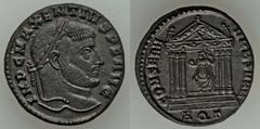 Maxentius (AD 306-312). Æ follis (6.92 gm). Aquileia, 3rd officina, AD 307-309/10. Laureate head right / Roma seated within hexastyle temple, holding globe and scepter. RIC 121a. Brown patina. Extreme