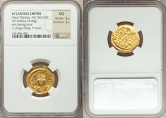 Maurice Tiberius (AD 582-602). AV solidus (4.46 gm). Constantinople, 7th officina. Diademed and cuirassed bust facing, wearing plumed helmet, holding globus cruciger in right hand / Angel standing fac