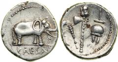 Julius Caesar, died 44 BC. AR Denarius likely minted in Gallia Narbonensis by Caesar, 49 BC. Elephant walking right, trampling snake. Reverse: Pontifical emblems. Julia 9; Cr. 443/1; Syd. 1006. Provin