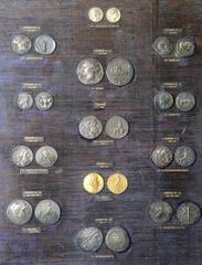 Impressive 19th Century British Museum Electrotype Collection of Classic Greek Coins. Mounted on dark blue velvet (toned and aged) with partially imprinted descriptions behind glass in a contemporary 
