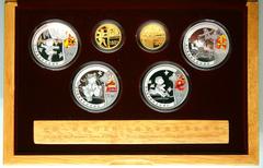 China. Gold and Silver Set for the Beijing Olympic Games, 2008. Gold 150 Yuan (2 pieces). 1/3 Ounce each .999 fine gold. Silver 10 Yuan (4 pieces) 1 ounce each. Gold features an ancient Chinese archer