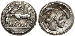 Sicily, Syracuse. Deinomenid Tyranny. Silver Tetradrachm (17.13 g), 485-466 BC. Under Hieron I, ca. 475-470 BC. Charioteer, holding kentron and reins, driving slow quadriga right; above, Nike flying r