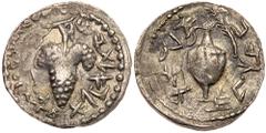Judean Coins Judaea, Bar Kokhba Revolt. Silver Zuz (2.58 g), 132-135 CE. Year 1 (132/3 CE). 'Eleazar the priest' (Paleo-Hebrew), jug with handle; at right, willow branch. Reverse: 'Year one of the red