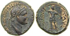 Domitian, 81-96 C.E. AE 23 minted at Caesarea. AJC pl. 36, 2. Hen-753. Laureate head right of Domitian. Reverse: The deified Titus standing, facing to right, holding spear and parazonium. Nearly Extre