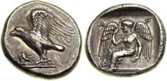 Peloponnesos. Elis. AR Stater (11.91 g), struck c. 432 BC, for the 87th Olympiad. Eagle standing left on groundline, his wings raised up; a dead heron to left at his feet. Reverse: Nike seated left on