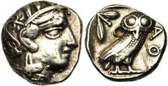 ATTIQUE, ATHENES, AR tétradrachme, 4e s. av. J.-C. Droit : Tête casquée d'Athéna à droite, le casque orné d'un fleuron et de feuilles d'olivier. Revers : Chouette à droite, tête de face. A gauche, pou