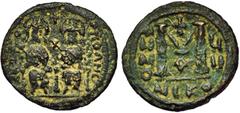 ORIENTAL WORLD : Arab-Byzantine - Turkey ARAB-BYZANTINE, AE follis, year 7 (frozen; c. 675-700), Baysan (Skythopolis). Mint name in Greek only. Obv./ Twin figures, type of Justin and Sophia. Rev./ Cap