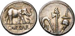 ROMAN REPUBLIC Jules César, AR denier, 49-48 av. J.-C., Gaule. D/ CAESAR Eléphant à d. piétinant un dragon. R/ Emblèmes sacerdotaux: culullus, aspergillum, hache et apex. Cr. 443/1; Syd. 1006. 3,97g. 