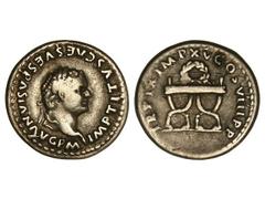 Denario. Acuñada el 79-80 d.C. TITO. Anv.: IMP. TITVS CAES. VESPASIAN. AVG. P. M. Cabeza laureada a derecha. Rev.: TR. P. IX IMP. XV COS. VIII P. P. Guirnalda y silla curul. -318. (MBC).