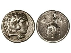Tetradracma. 336-323 a.C. ALEJANDRO MAGNO. Anv.: Cabeza de Hércules con piel de león a derecha. Rev.: Zeus entronizado a izquierda delante símbolo, detrás leyenda. 17 grs. AR. Se-6721 var. MBC+/MBC-.