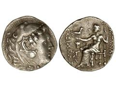 Tetradracma. 336-323 a.C. ALEJANDRO MAGNO. Anv.: Cabeza de Hércules con piel de león a derecha. Rev.: Zeus entronizado, detrás leyenda, delante leyenda y símbolos. 17 grs. AR. Price-948F var. MBC+.